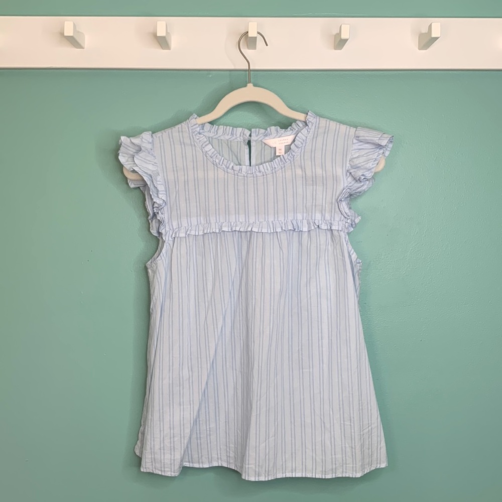 Sleeveless blouse with ruffle